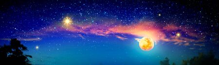 Full moon with Christmas star at dark night sky .の写真素材