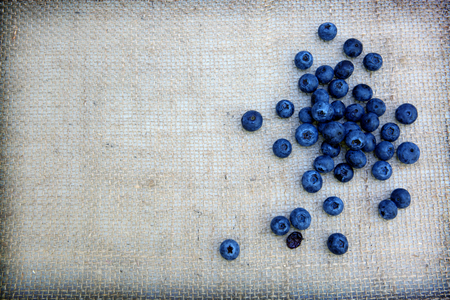 Blueberry isolated on cloth background. Nature food background.の写真素材