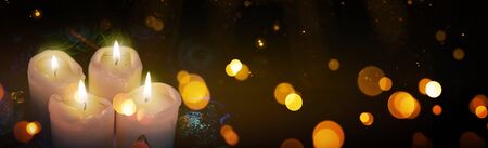Four burning Advent candles and lights.. Christmas background.の写真素材