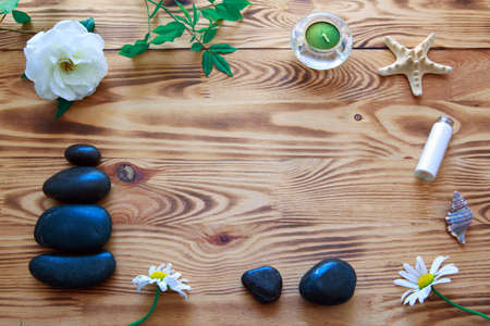 Spa setting with white rose and spa stones. Wellness concept.の写真素材