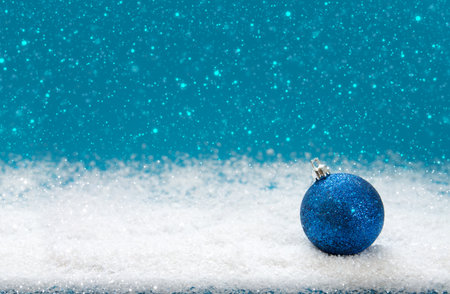 Blue Christmas ball isolated on blue background.の写真素材