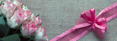 Valentines day background with roses and loop isolated on brown .の写真素材