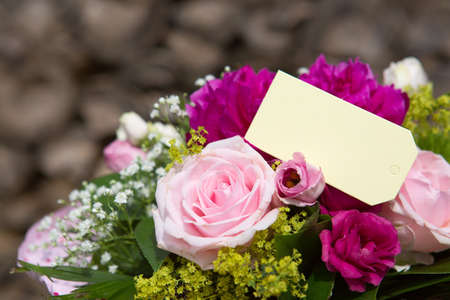 A bouquet of roses and label isolated on gray backgroundの写真素材
