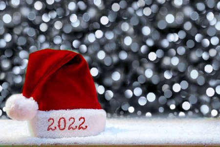 Happy new year 2022 Santa Hat and white snow.