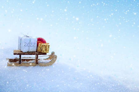 Christmas background with snow and wood sled stand in white snow.