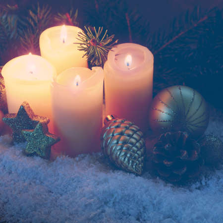 Four pink burning advent candles. Christmas card.の写真素材