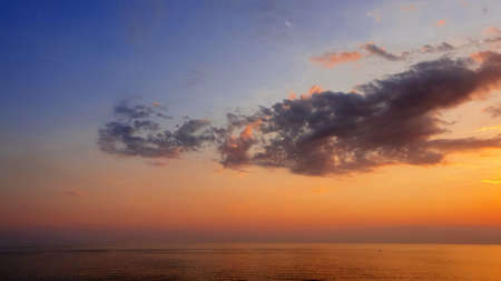 Sunset of sea beach and colorful sky background.の写真素材