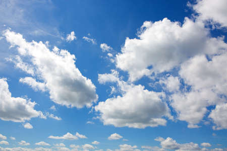 Sunny background with blue sky and white clouds as summer natural background.の写真素材