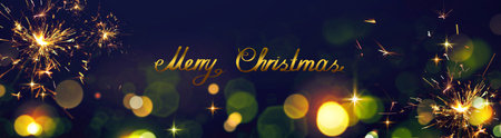 Merry Christmas text on blurred bokeh light background.の写真素材