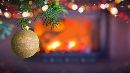 Christmas ball against a stone fireplace.Holiday background.の写真素材
