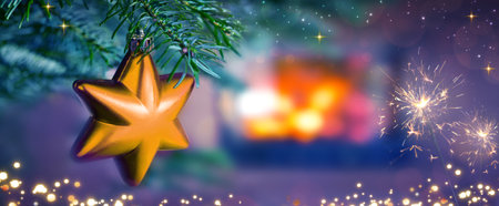 Christmas star against a stone fireplace.Holiday background.の写真素材
