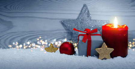 Christmas background with red Advent candle and decorationの写真素材