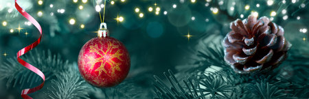 Christmas ball hanging on green fir tree branch .の写真素材