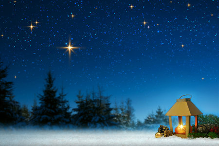 Christmas lantern on white snow.Winter blue background.の写真素材