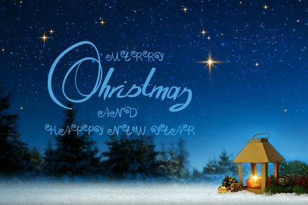 Christmas lantern on white snow.Merry Christmas and Happy new Year text.の写真素材