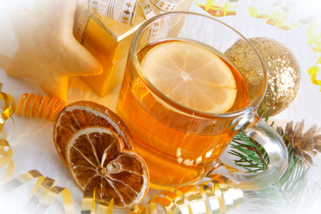 Herbal tea with fresh lemon isolated and Christmas decoration.の写真素材
