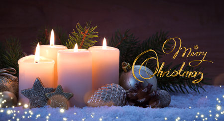Four Advent candles with Christmas decorations isolated on brown bokeh background.の写真素材