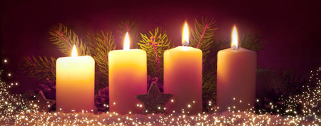 Four Advent candles with Christmas decorations isolated on blur bokeh background.の写真素材