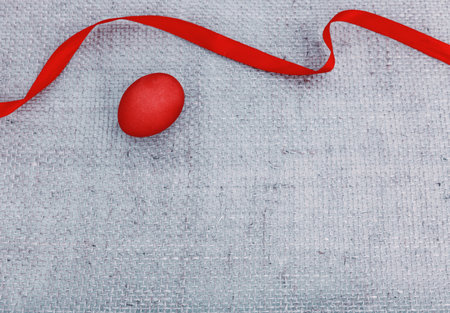 Easter egg and red ribbon as decoration.の写真素材