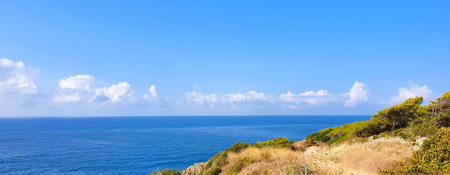 Blue sky and rock beach by the sea .の写真素材