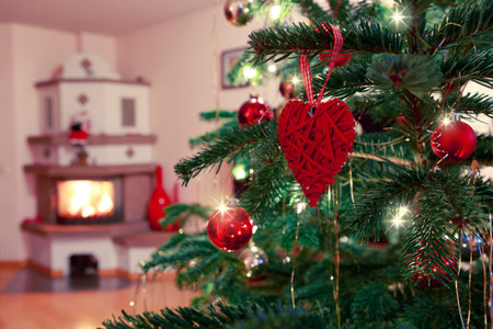 Christmas and New Years background with fir tree and blur burning fireplace .の写真素材