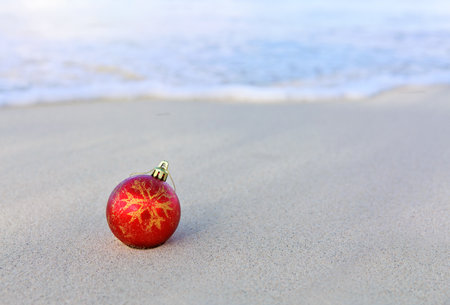 Merry Christmas ball on the white Caribbean sand.の写真素材