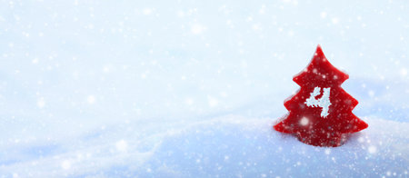 Fourth Advent background with red fir tree and white snow.の写真素材