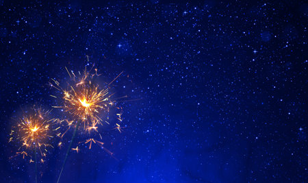 Firework sparkler burning isolated black background.の写真素材