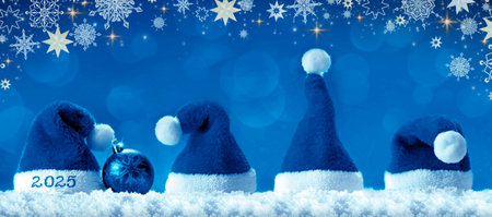 Santa hats isolated on blue background. Happy new year 2025.の写真素材