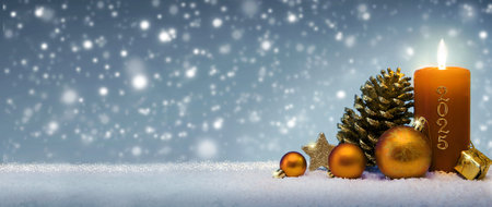 2025 Advent background with golden candle on white snow.の写真素材