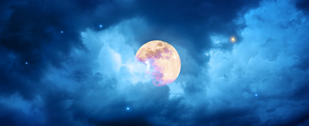 Night sky with full moon in the colorful clouds.の写真素材