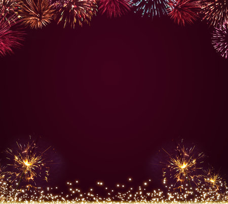 New Year fireworks in the red night sky.の写真素材
