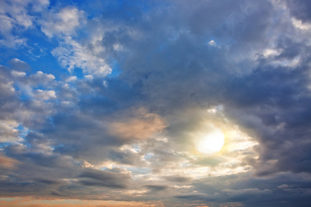 Evening sunshine background with clouds dramatic sky.の写真素材