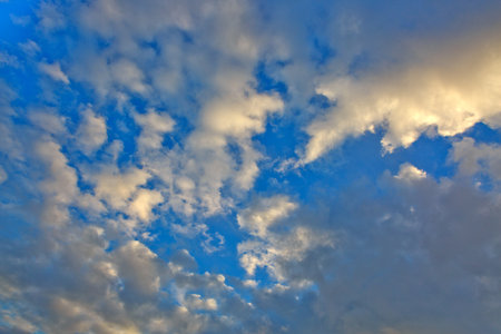 Evening sunshine background with clouds dramatic sky.の写真素材