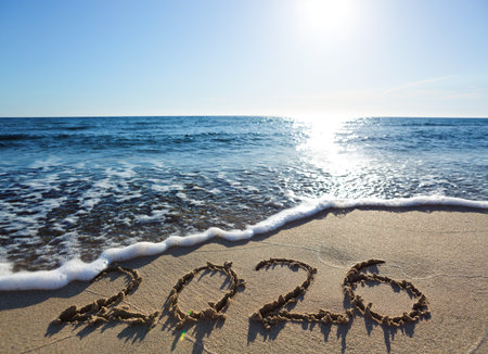 New Year 2026, lettering on the beach sand.
