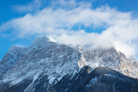Panoramic view of beautiful winter mountain scenery in the Alps in sun light.の写真素材