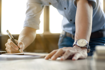 Business man working at office with laptop and documents on his desk  freelancer concept