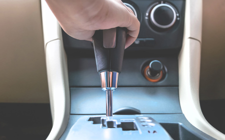 close up hand holding to change the gear inside a carの写真素材