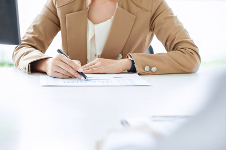 Business executives analysis data document with accountant at workplaceの写真素材