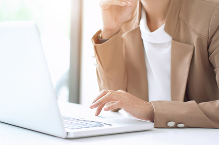 close up of Smart woman working at home office thinking new business projectの写真素材
