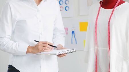 Stylish atelier Fashion Designer work as sketch of new collection