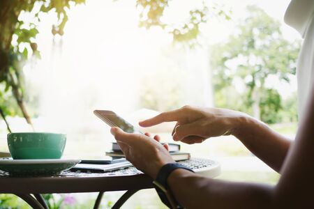 woman using mobile smart phone at a outdoorsの写真素材