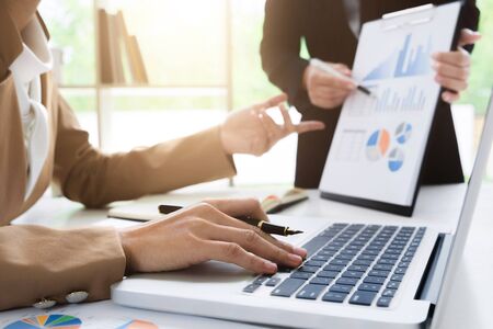 business financier audit working with laptop and data annual report