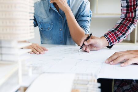 engineer colleagues working on blueprint, interior architect conceptの写真素材