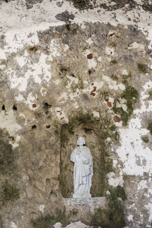 Divine Statue in a Caveの写真素材