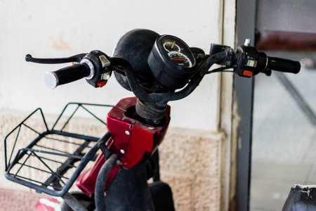 a closeup shoot to old scooter. photo has taken from an urban street.の写真素材