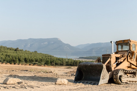 a construction machine was placed outside of city. photo has taken from izmir/turkey.