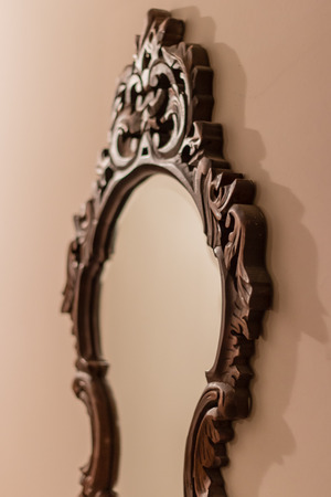 a perspective shoot to antique mirror with brown frame.の写真素材