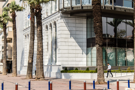a city shoot from izmir/turkey. there is a walking man under morning light.のeditorial素材