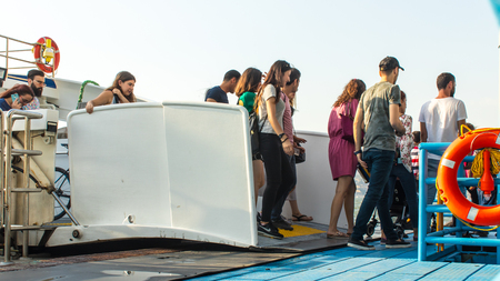 people exiting from steamboat at alsancak port. photo has taken from alsancak/izmir.のeditorial素材